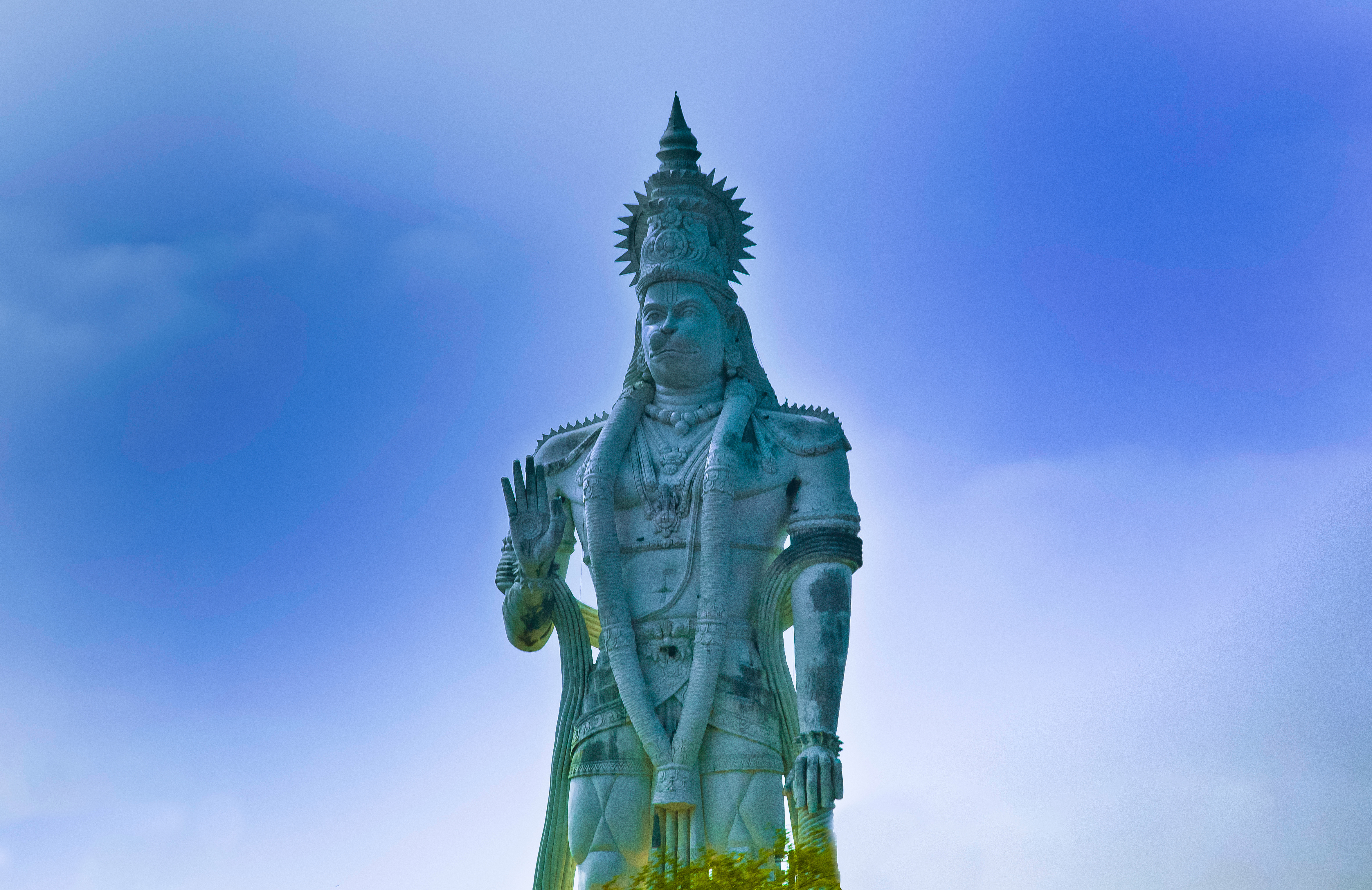 Green Statue Under Blue Sky